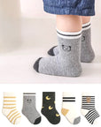 Baby wearing grey bear patterned cotton baby socks – soft everyday socks
