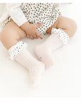 Baby girl wearing pink ruffle socks – cute frilled baby socks by BabyWonders UK