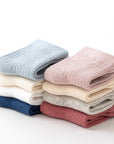 White ribbed baby socks close-up – soft breathable cotton material
