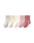 Set of five baby socks in gray, beige, white, and pink on a white background