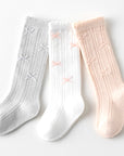 Folded cotton knit baby socks in neutral tones – soft and elegant design