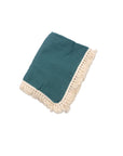 Turquoise cotton baby blanket with tassel edges, soft breathable newborn blanket for nursery, cot and stroller use.