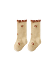 Yellow baby socks with embroidered daisies and soft ribbed design