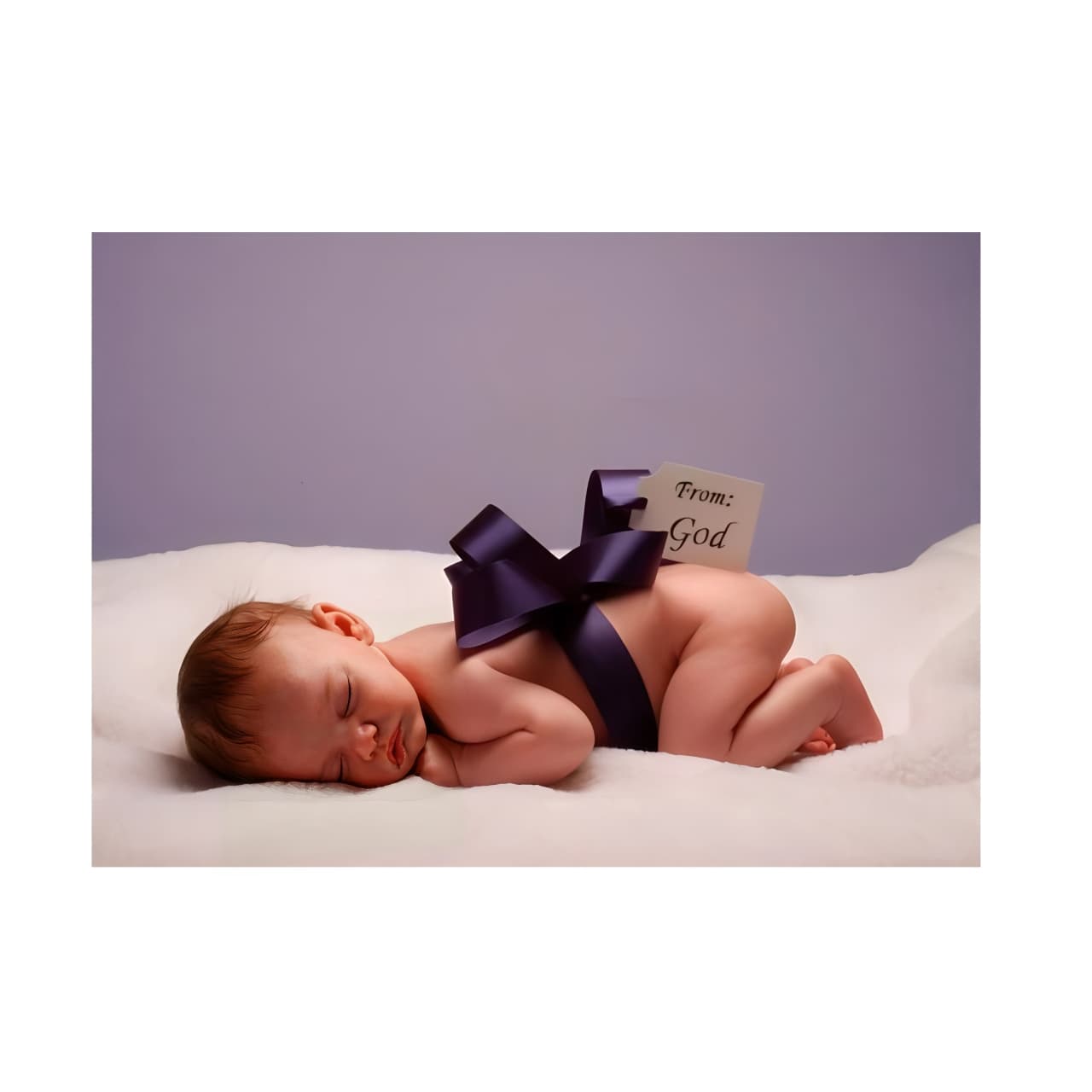 Newborn baby sleeping with purple gift bow ribbon, perfect affordable newborn gift idea
