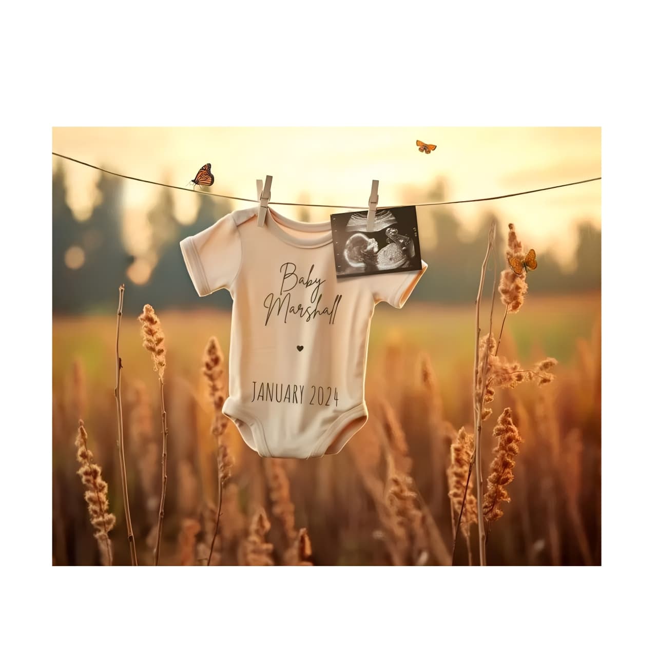 Newborn baby clothes hanging on clothesline in wheat field, rustic baby shower gift set inspiration.