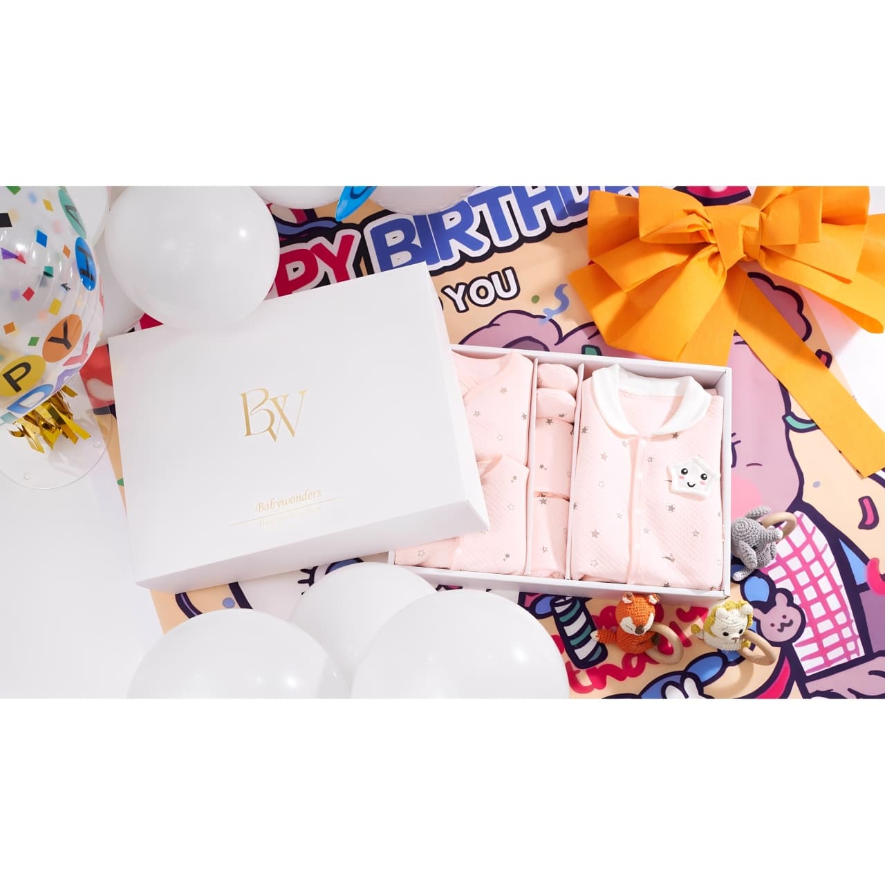 Colorful personalized baby gift set with custom cards and packaging, ideal newborn present for lasting memories.