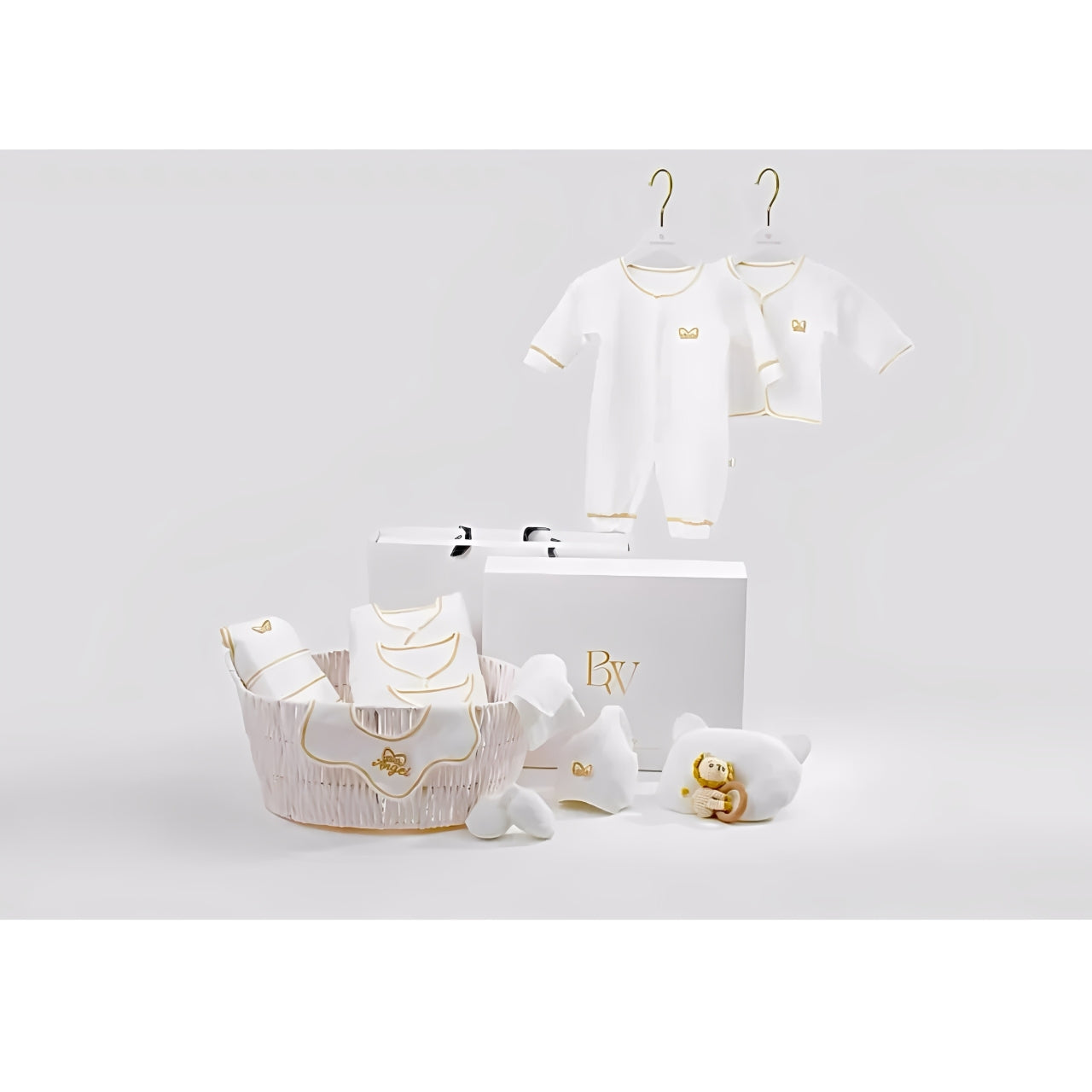 Minimalist newborn clothing gift set in white, must-have essentials for baby shower gifts.