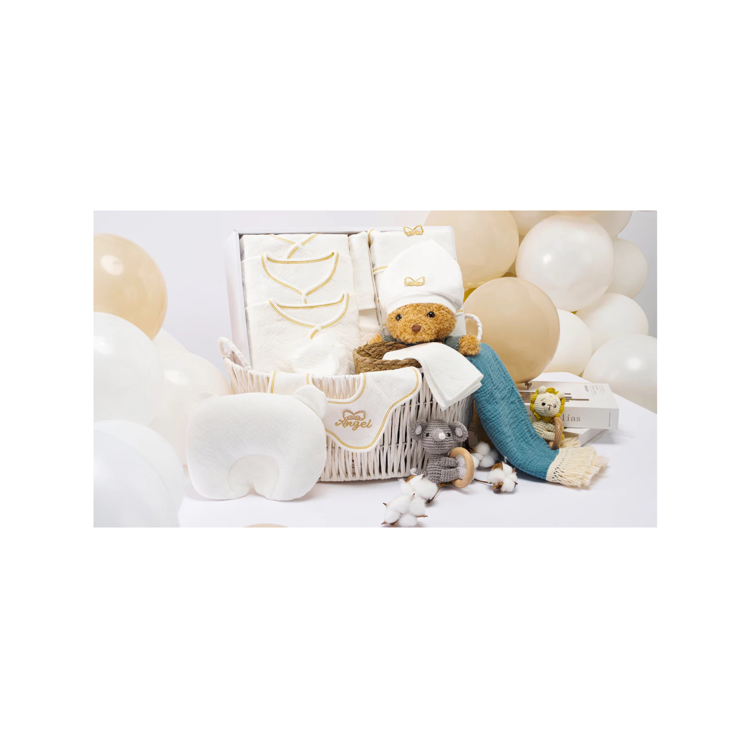 Newborn gift set with teddy bear, balloons, and cozy baby items, ideal for all seasons.