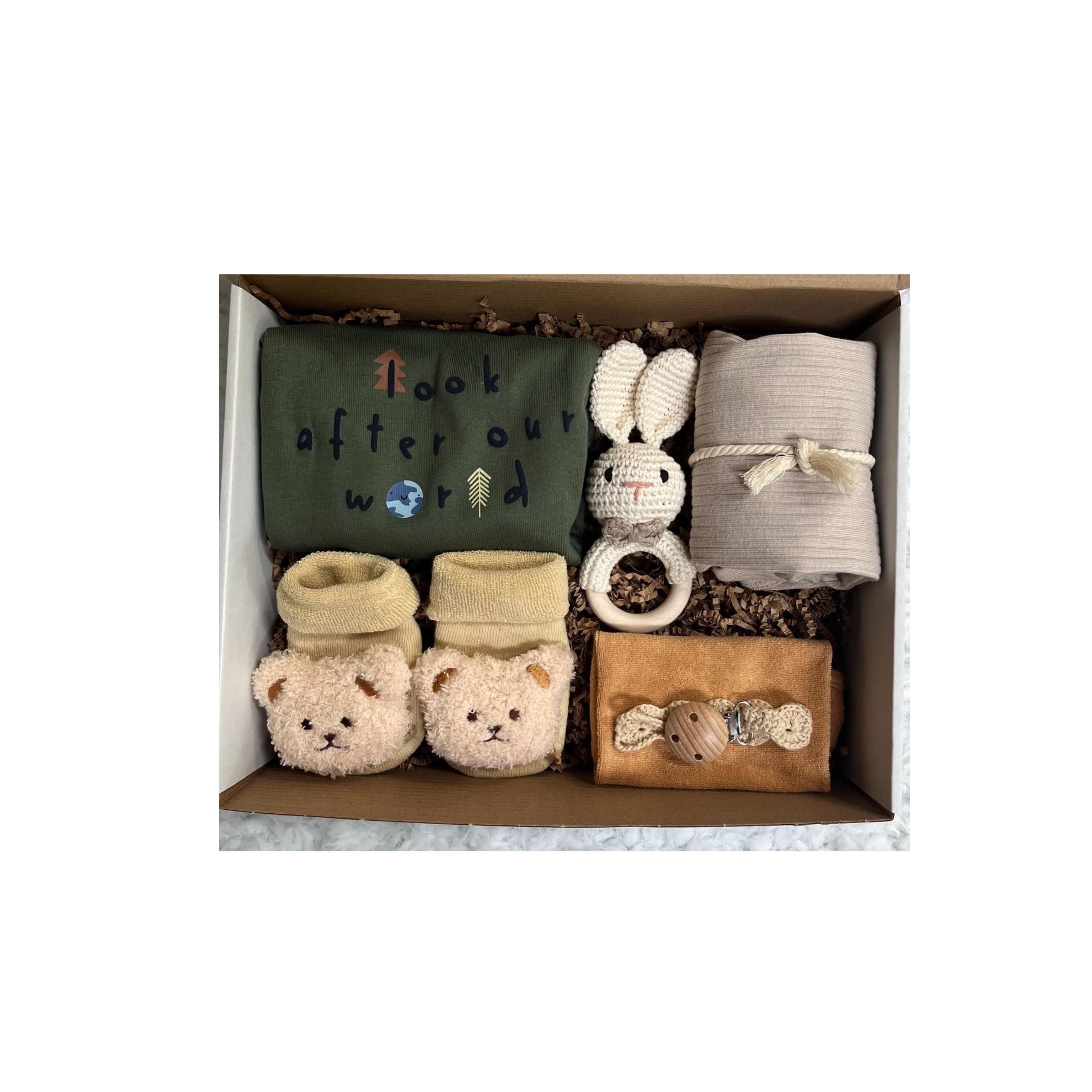 Cute baby bundle gift set with plush toys, onesies, and newborn essentials
