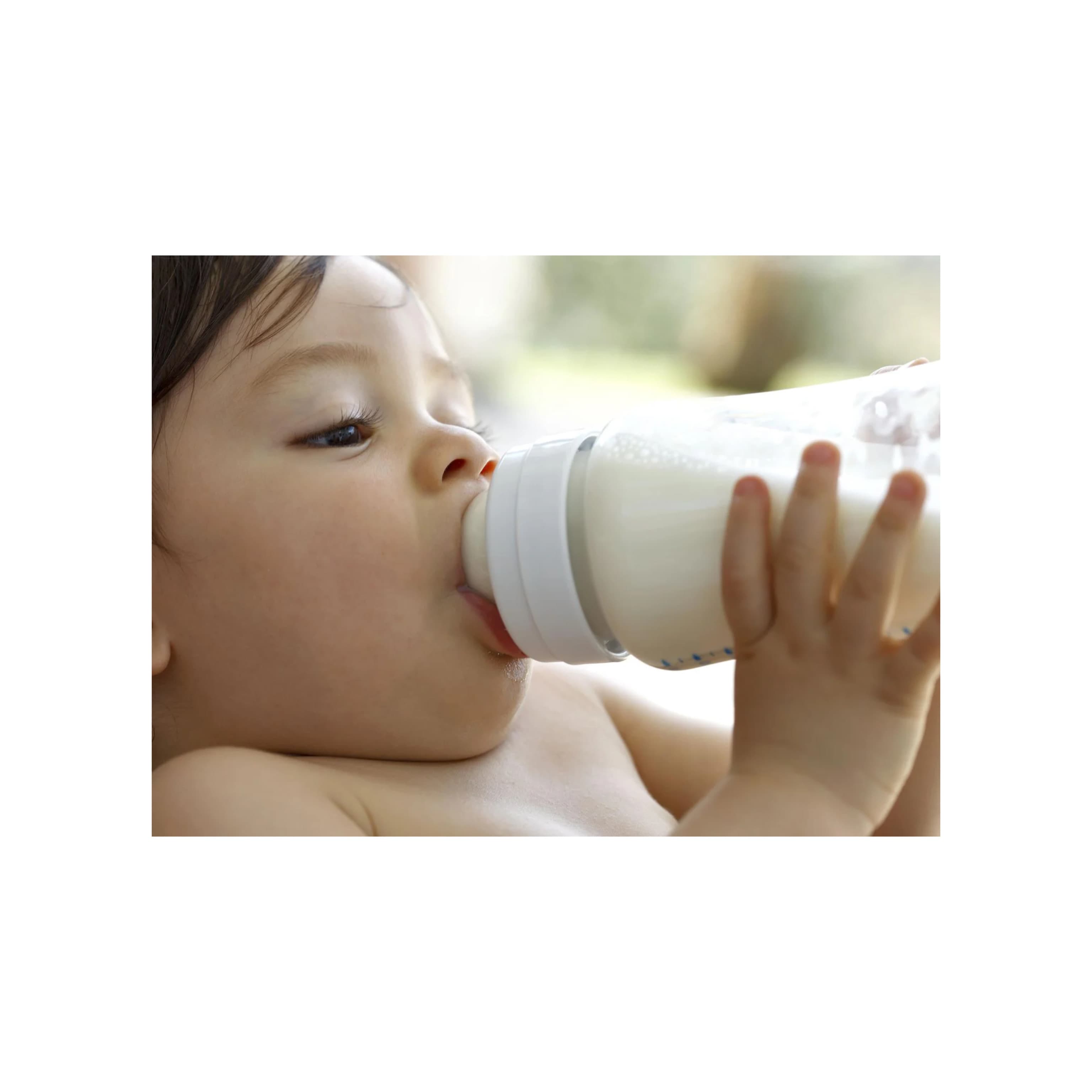 Newborn baby drinking milk from bottle, essential feeding guide for parents