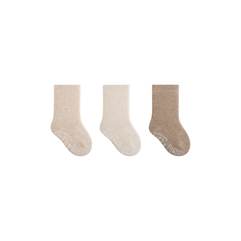 Three pairs of socks in beige, white, and brown on a white background