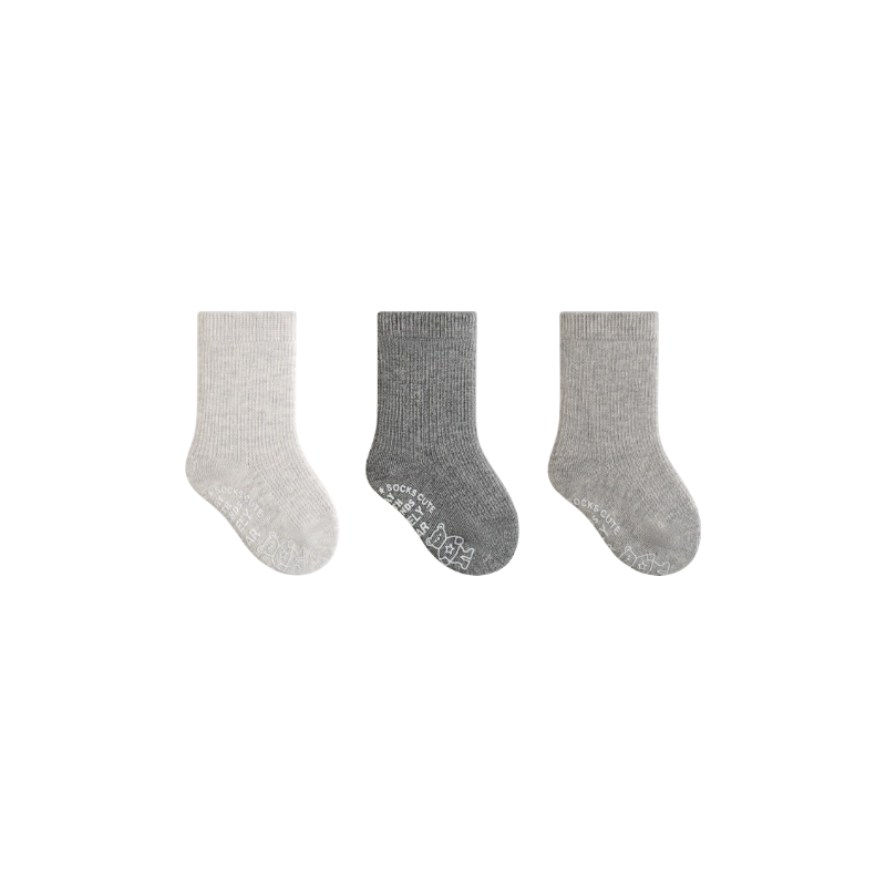 Three pairs of gray socks on a white background