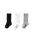 Three socks in black, white, and gray on a white background