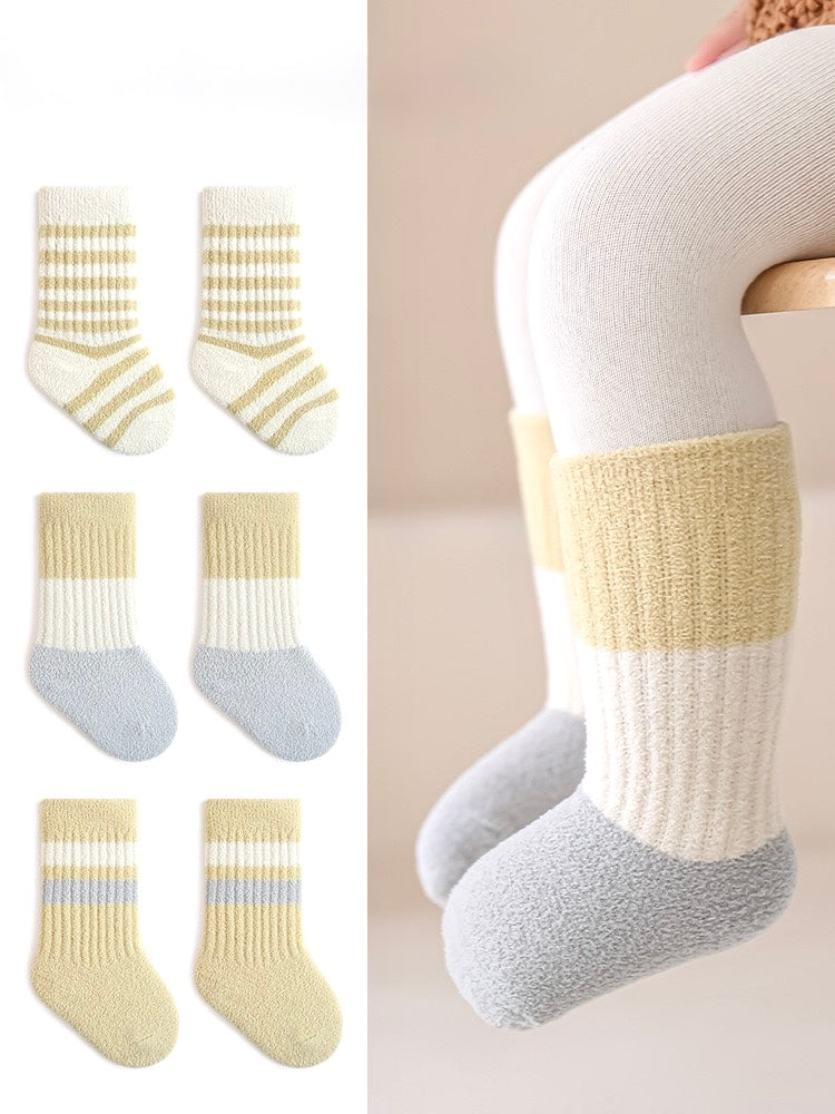 Set of baby socks with striped patterns on a white background