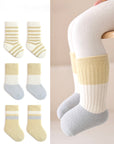 Set of baby socks with striped patterns on a white background