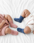 Two babies wearing ribbed cotton baby socks in blue and pink, soft breathable everyday baby socks for infants