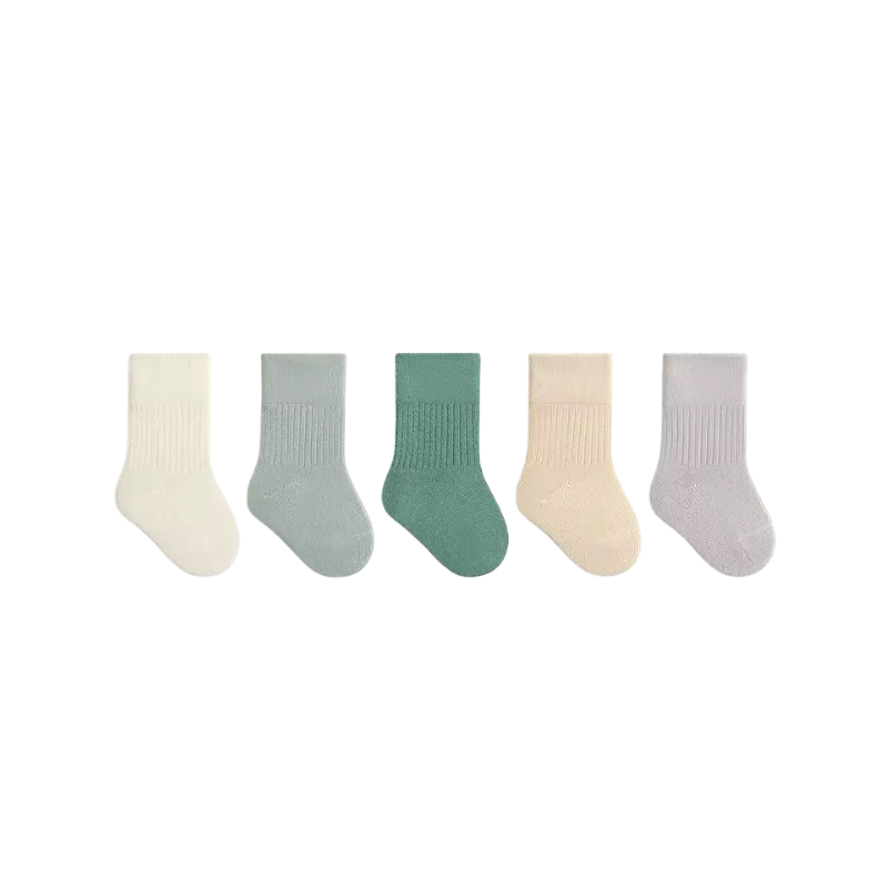 Set of five pairs of green socks in various colors on a white background