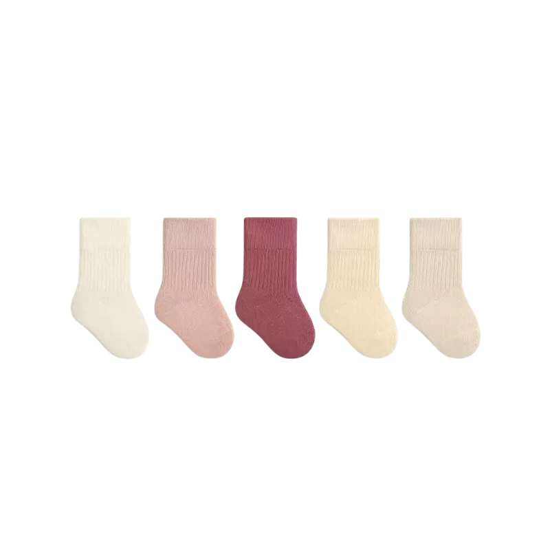 Set of five pairs of pink socks in various colors on a white background