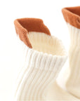 Flat lay of 3-pack anti-slip ribbed baby socks – cotton breathable non-slip design