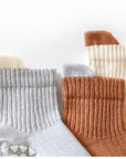 Close-up of anti-slip sole dots on ribbed cotton baby socks