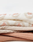 Stack of Australian cotton baby socks in neutral colors, soft breathable fabric layers.