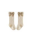 Beige baby knee-high socks with lace pattern and grosgrain bow, soft cotton blend for infants

