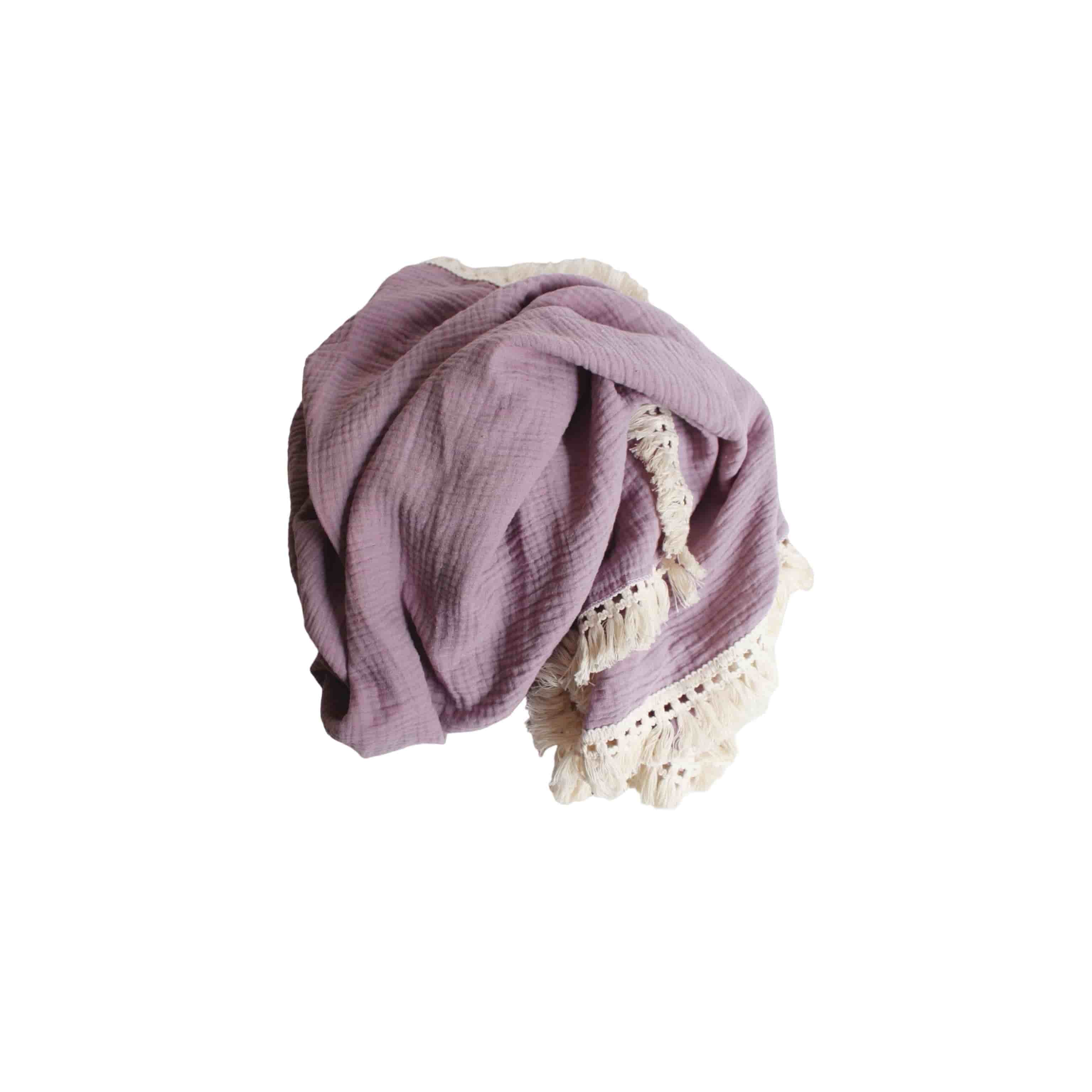 Baby sleeping in a cot with a purple cotton tassel blanket, soft breathable newborn blanket for nursery and everyday comfort.