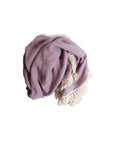 Baby sleeping in a cot with a purple cotton tassel blanket, soft breathable newborn blanket for nursery and everyday comfort.