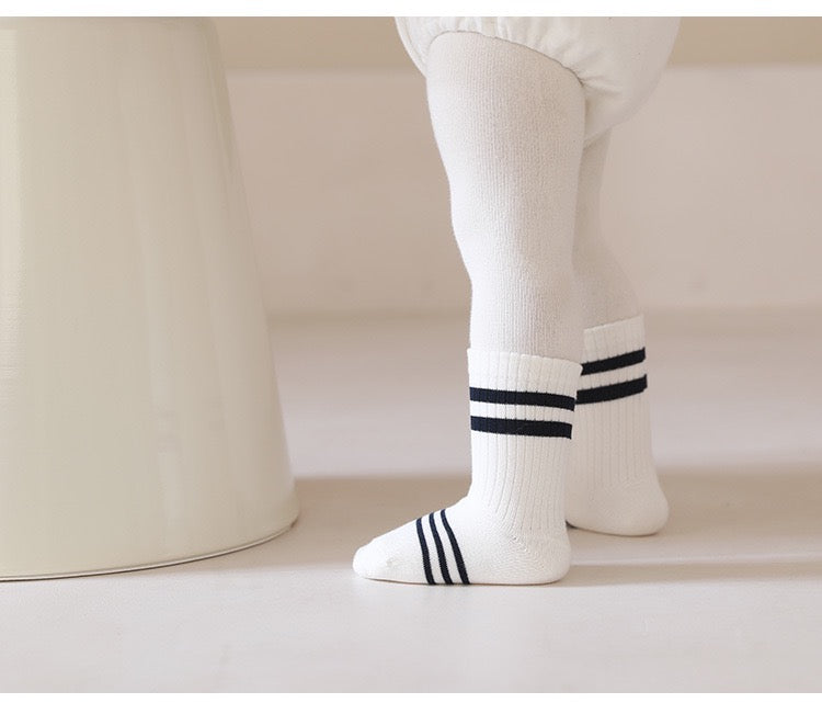 Toddler wearing navy bear socks – unisex soft cotton baby socks from BabyWonders UK
