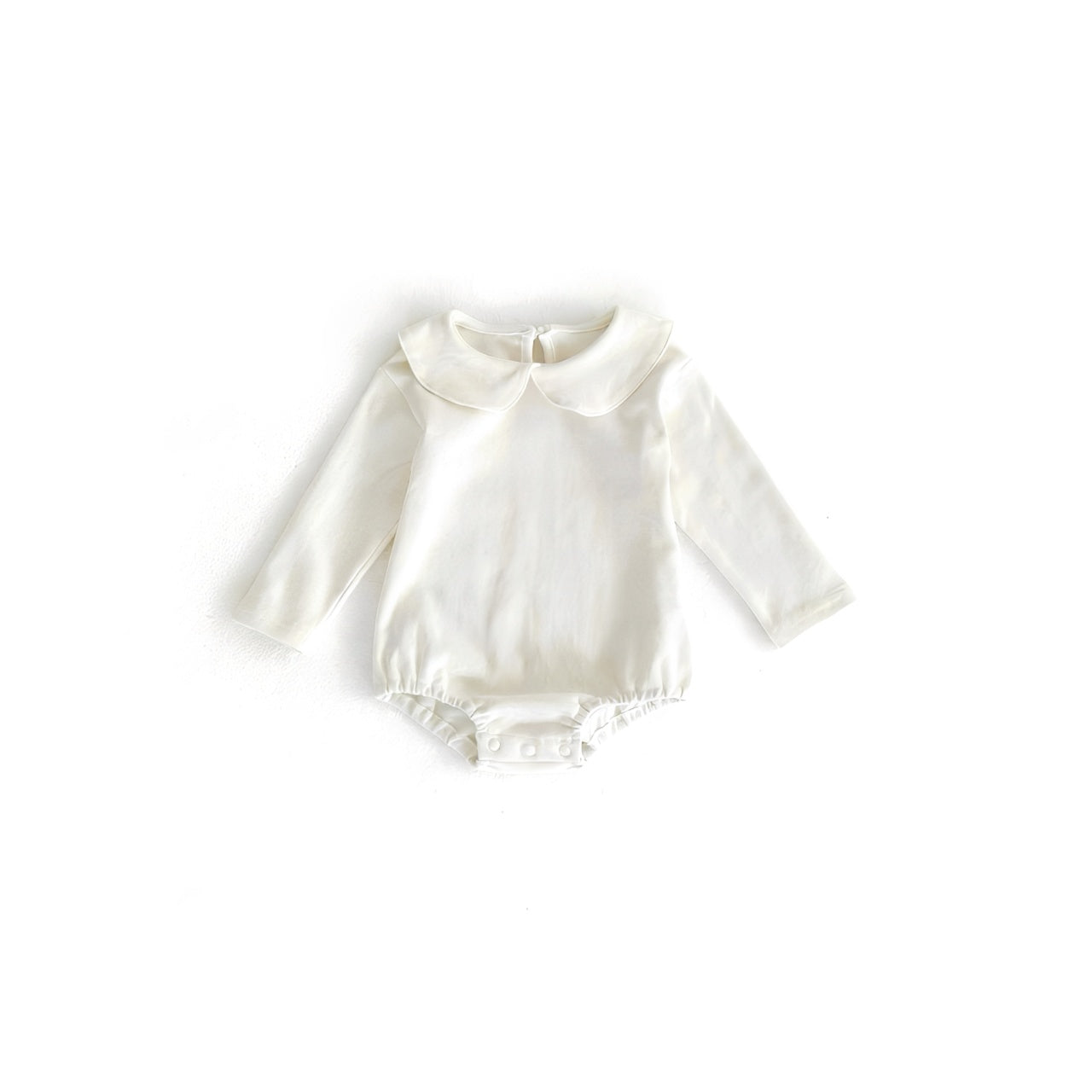 Baby Peter Pan collar romper in classic white with long sleeves and snap fastening