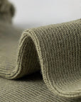 Soft long-staple cotton knit texture close-up showing breathable and durable