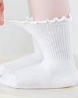 Stretchable cotton baby socks showing flexible elastic cuff that won’t leave marks