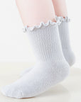 White ruffle baby socks made from soft combed cotton, perfect for sensitive skin
