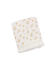 Sleeping newborn baby wrapped in a sunflower print cotton baby blanket with tassel trim, soft breathable blanket for nursery naps and everyday comfort.