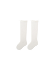 Baby wearing white ribbed long baby socks – knee-length cotton socks UK