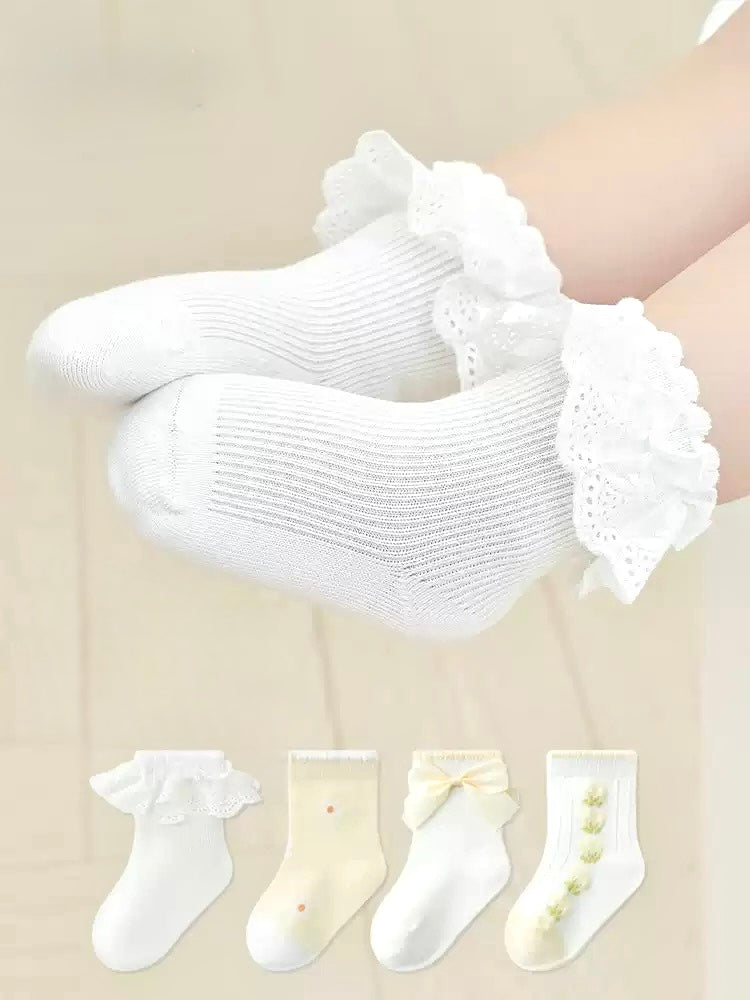 Baby wearing floral bow baby socks – soft cotton embroidered baby socks UK