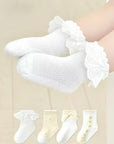 Baby wearing floral bow baby socks – soft cotton embroidered baby socks UK