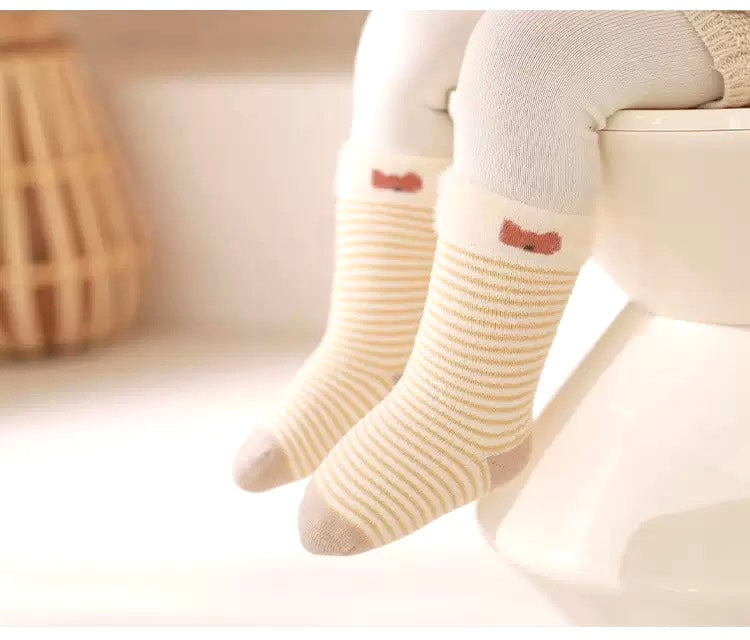 Baby wearing striped beige bear socks – soft breathable cotton comfort from BabyWonders UK