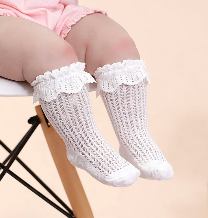 Cute baby in white lace mesh cotton socks, soft breathable infant socks perfect for daily wear.
