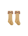 Yellow baby lace knee-high socks with brown ribbon bow, lightweight and breathable for toddlers
