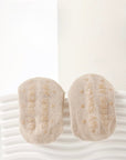 Close-up of beige baby socks with anti-slip sole and soft cotton texture