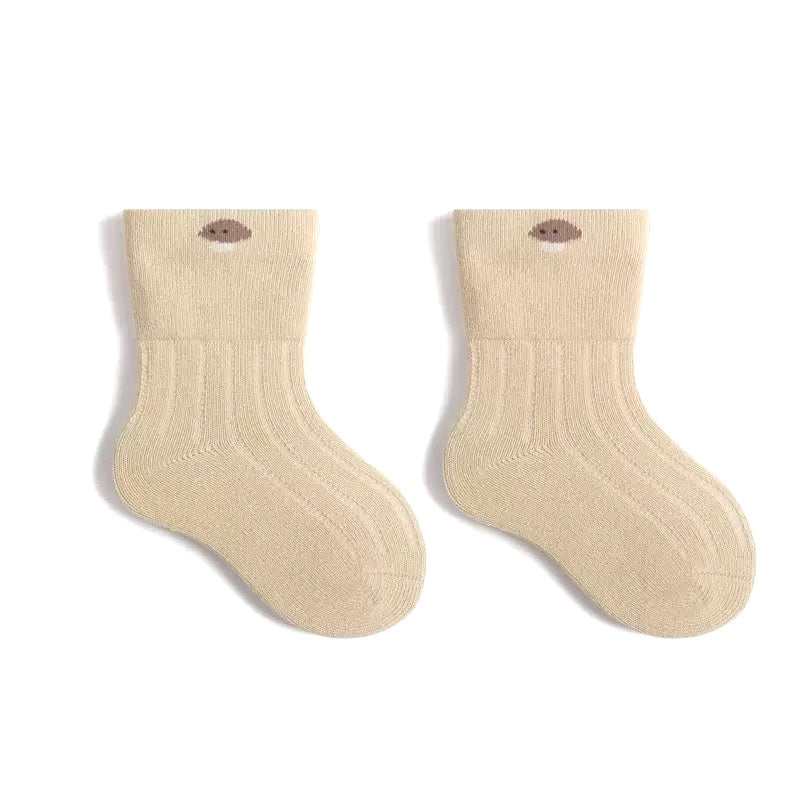 Pair of beige cotton baby socks suitable for boys and girls