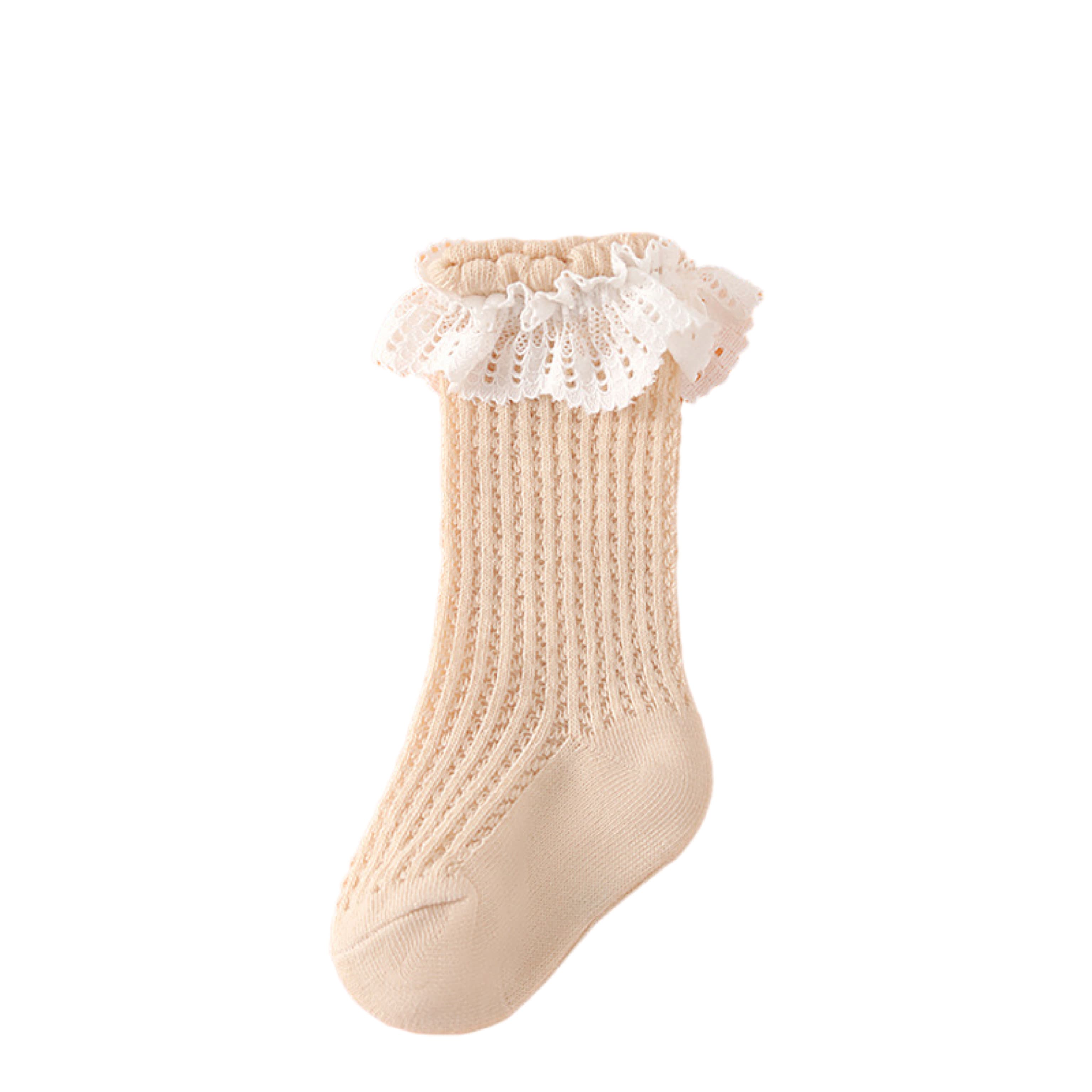 Beige cotton lace baby socks, elegant ruffle design with airy texture.