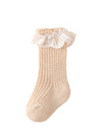 Beige cotton lace baby socks, elegant ruffle design with airy texture.
