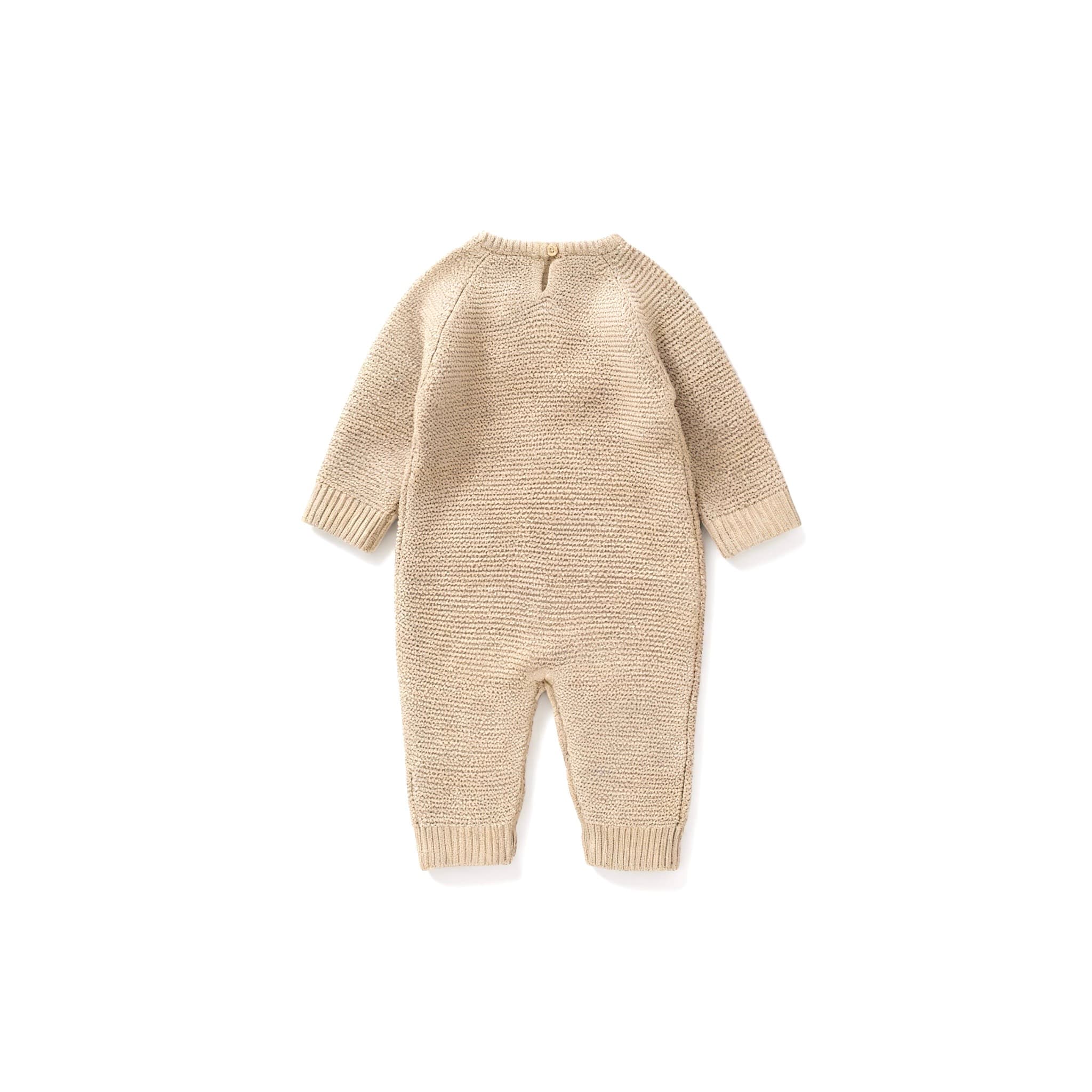 Back view of beige knitted baby romper showing soft texture and button closure at neck