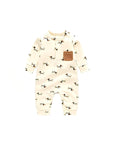 Front view of beige puppy print baby romper with contrast pocket, long sleeves, and snap buttons.