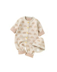 Beige rainbow knit baby romper with matching hat, soft cotton blend jumpsuit for infants and toddlers.