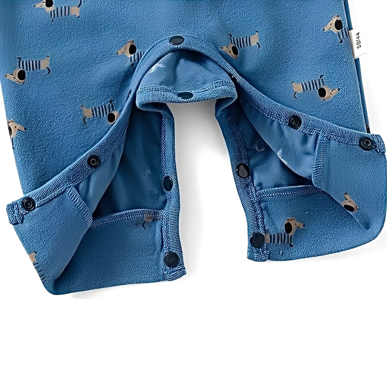 Bottom snap button closure detail on blue puppy print baby romper for easy diaper changing.
