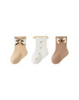 Three pairs of baby socks in brown and cream tones with cute bows, made from soft Australian cotton.
