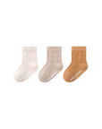 Baby wearing orange cable knit anti-slip socks – cosy cotton baby socks